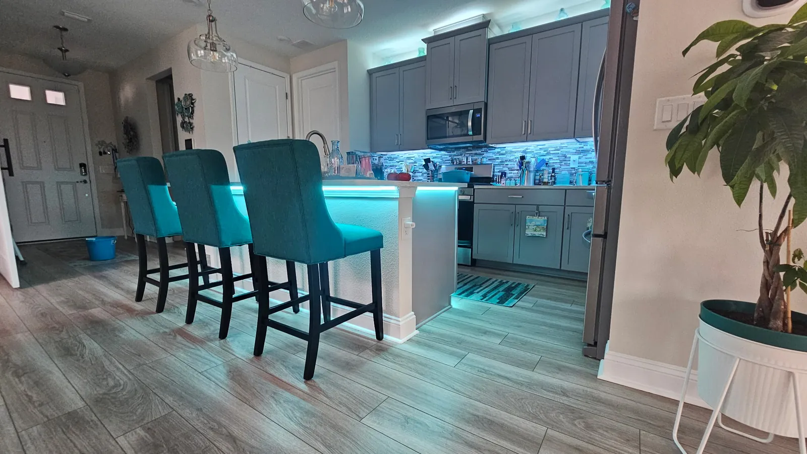 The cove run over the cabinets, teal