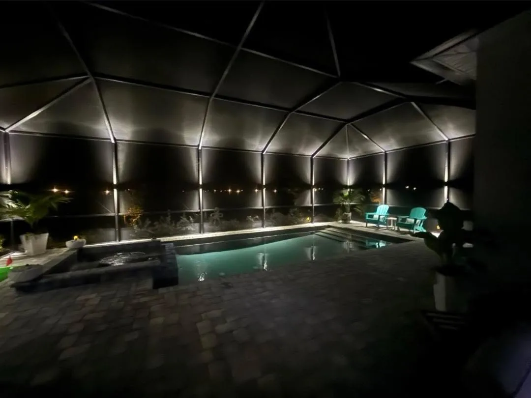 A finished enclosure lit cool white at night