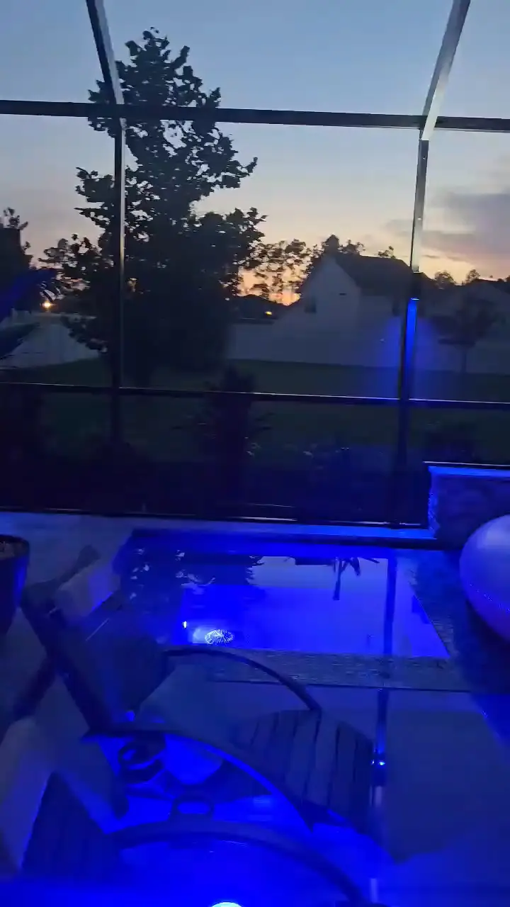 A slow pan through the finished enclosure, run deep blue at night