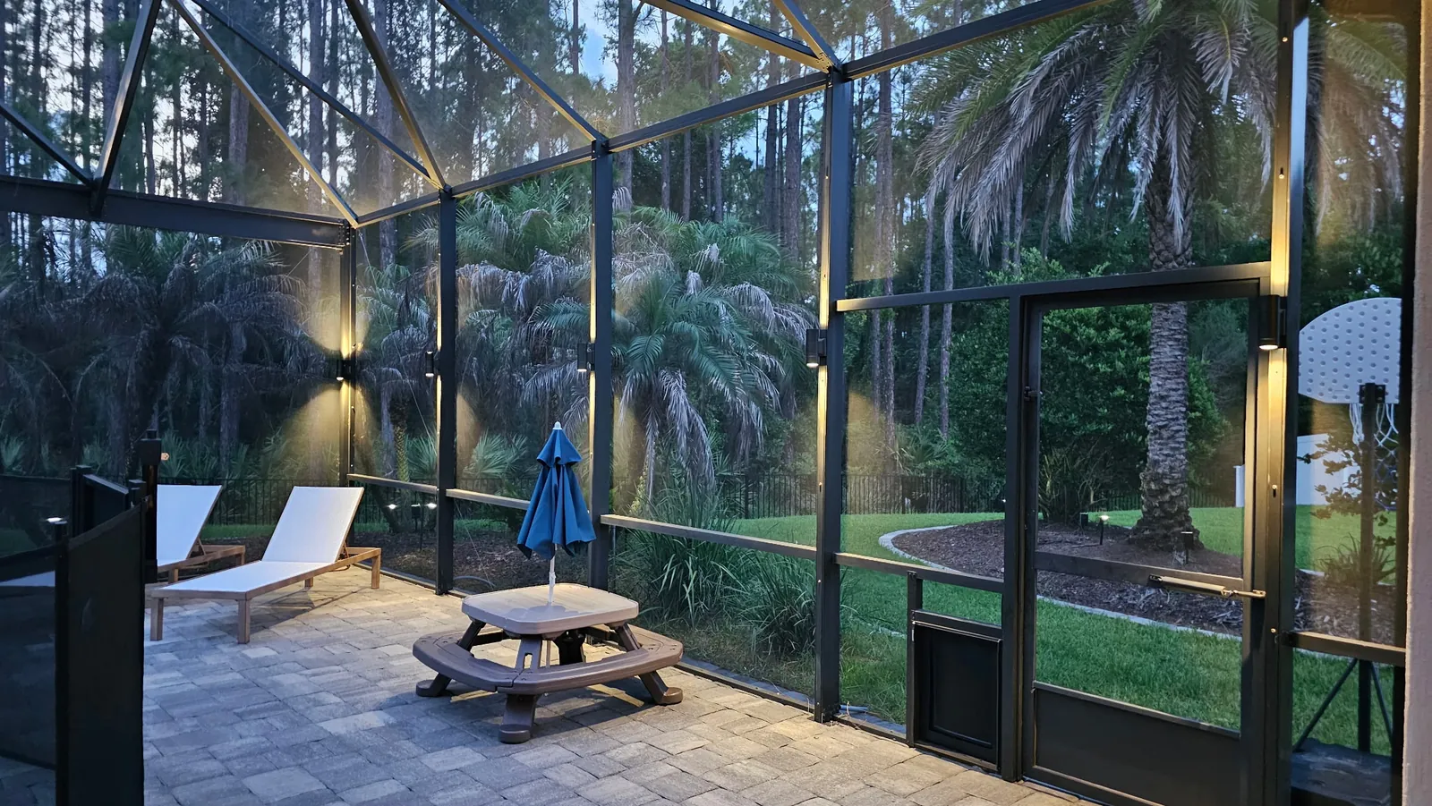 The child fence and pool inside the enclosure at dusk