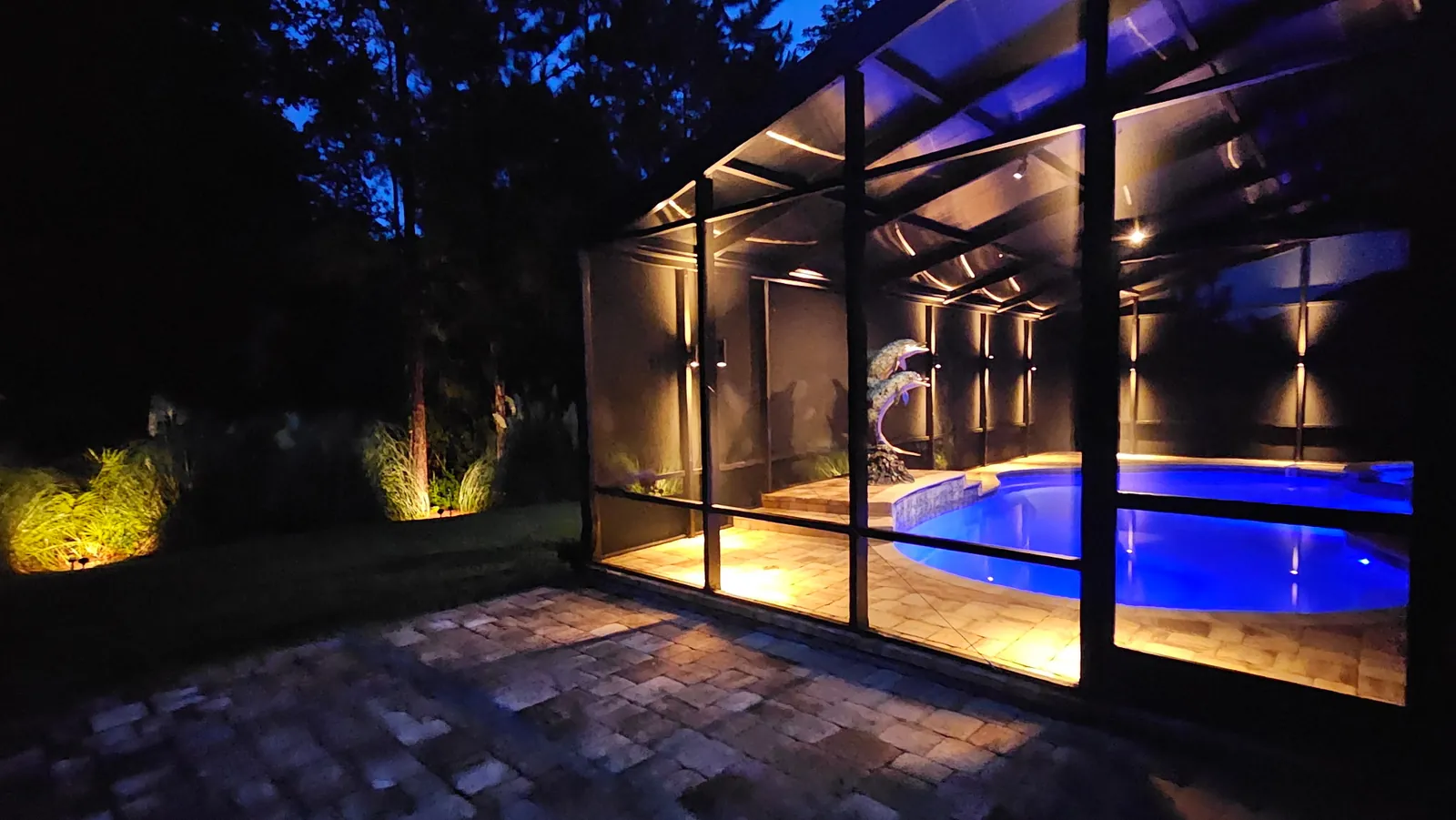 Looking across the water to the lit walkway